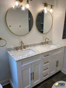 White bathroom with gold accents