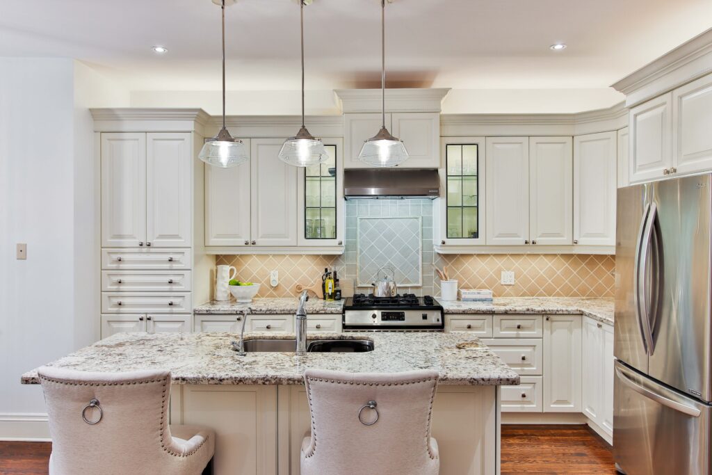 Traditional Kitchen with white cabinets and granite countertops