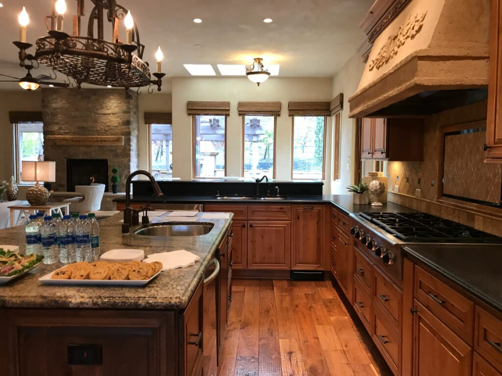 Traditional kitchen with large island and dark countertops