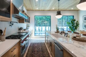 Rustic kitchen with large island and wood ceiling