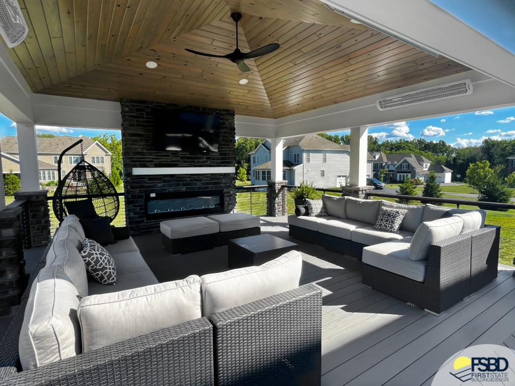 Pavilion over gray composite decking and fireplace