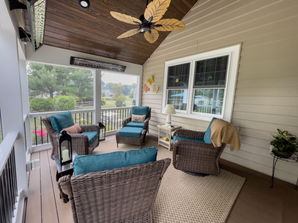 Three season sunroom over composite deck with railings
