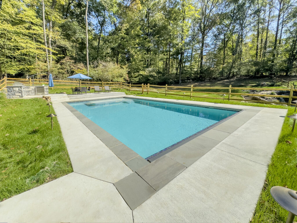 Beautiful inground pool with outdoor kitchen and patio
